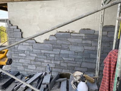 Stone veneer installation in progress