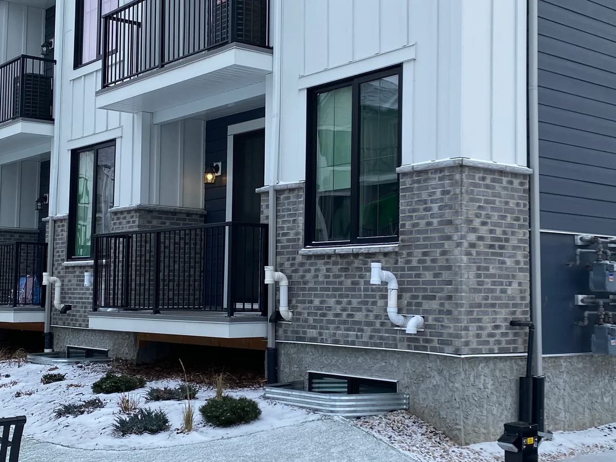 Grey brick foundation on modern townhouse