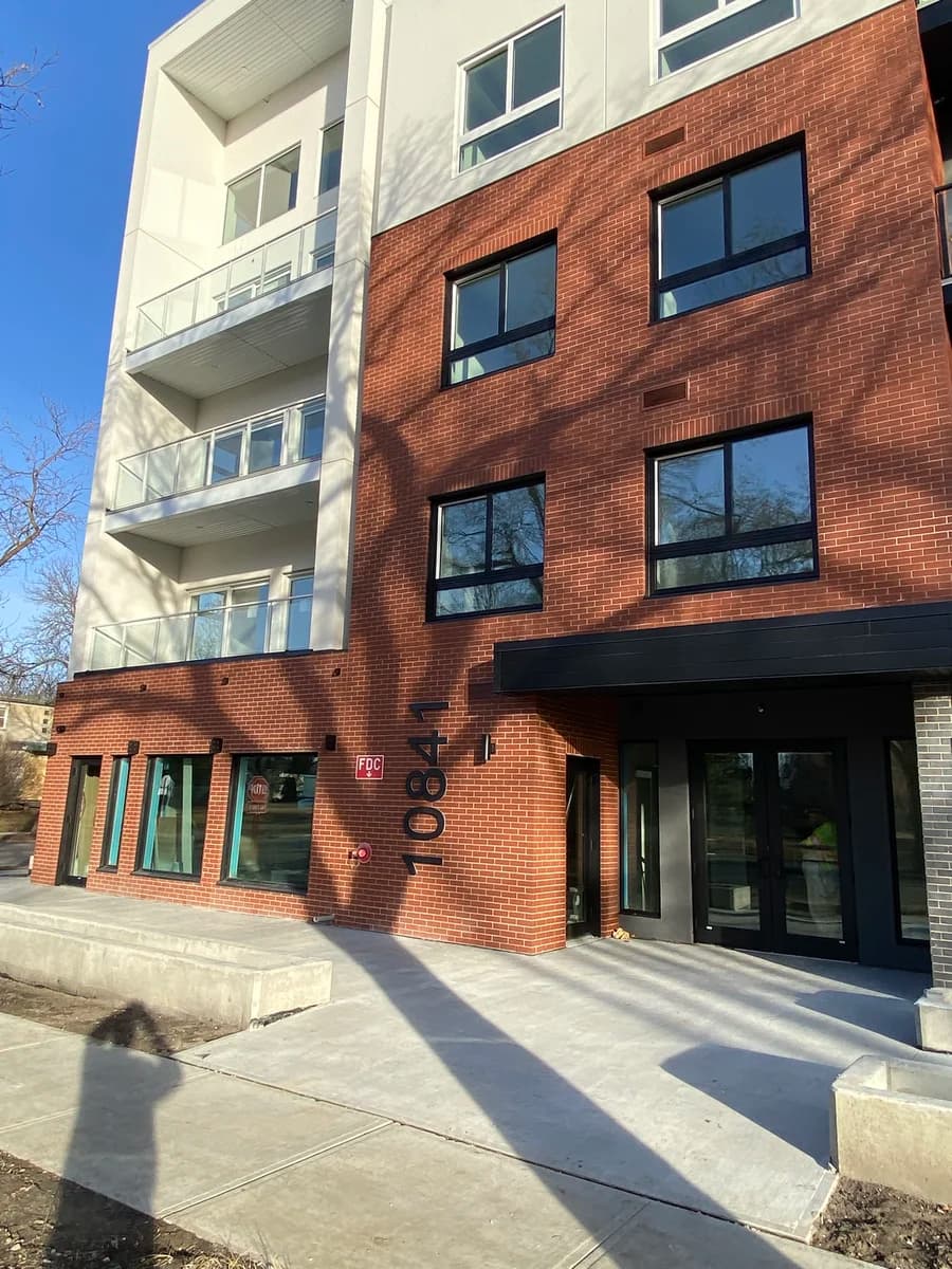 Red brick mixed-use building entrance